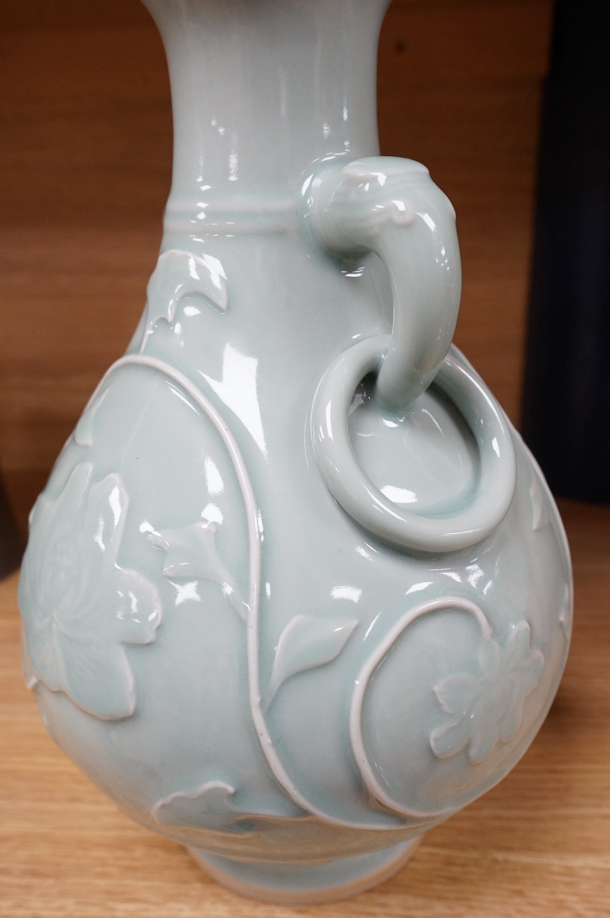 A Chinese celadon two handled vase, 32cm high. Condition - hole drilled to base.